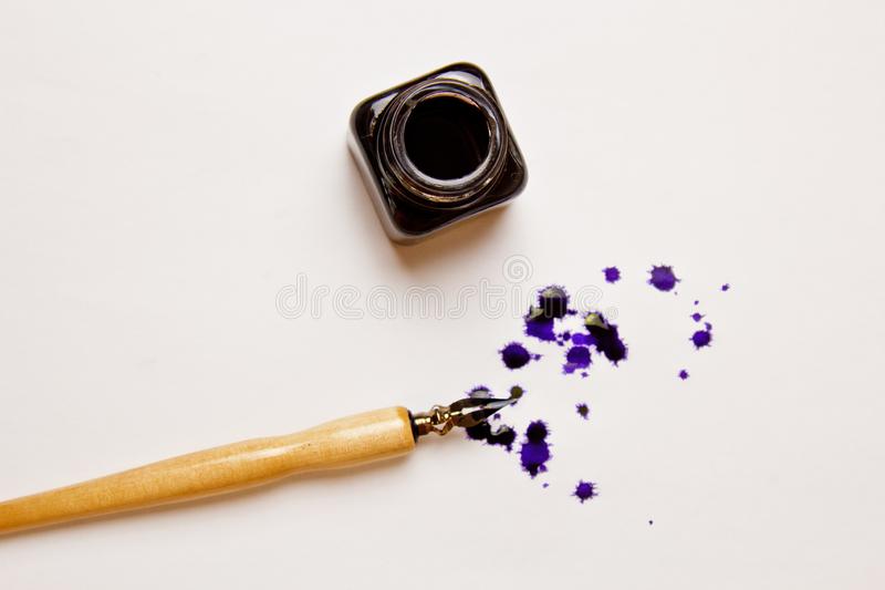 ink-stain-drawn-pen-white-paper-sheet-inkwell-blot-stationery-close-up-top-view-spelling-lessons-caligraphy-146470331